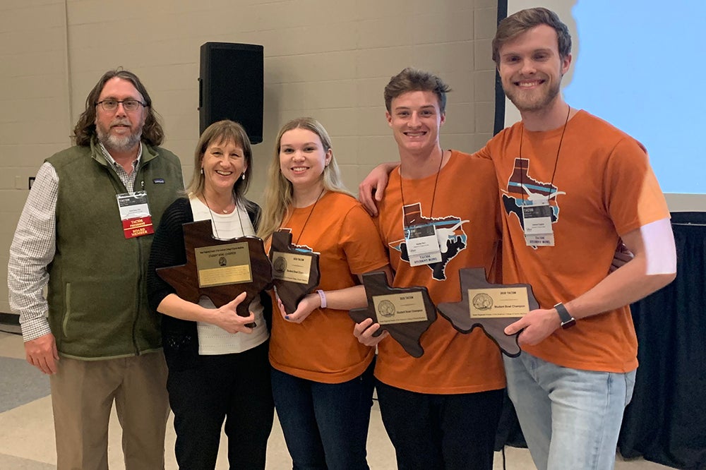 Michelle Harrison with her students and the TACSM president after winning the TACSM Bowl. 