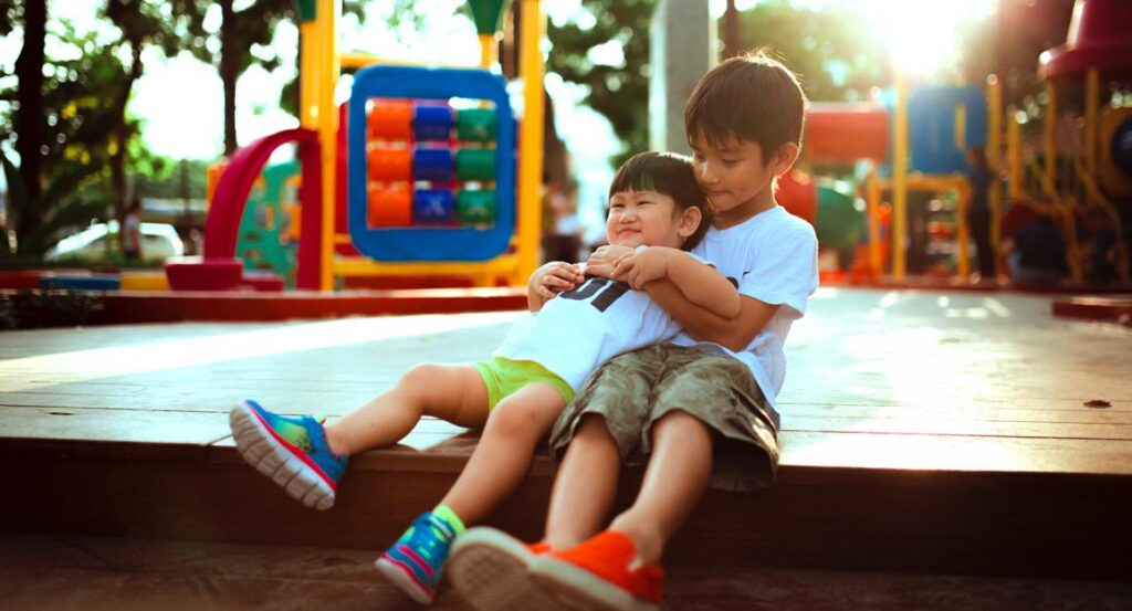 Two boys playing on a playground