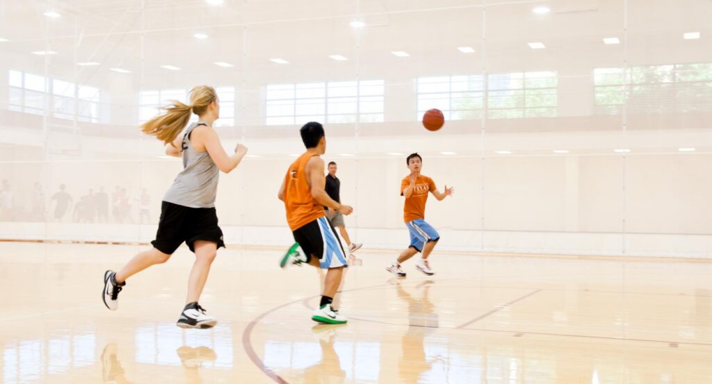 Students playing intramural basketball