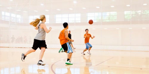 Students play basketball in Gregory Gym.