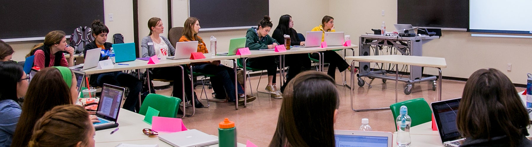 Students take notes during a special education class. 