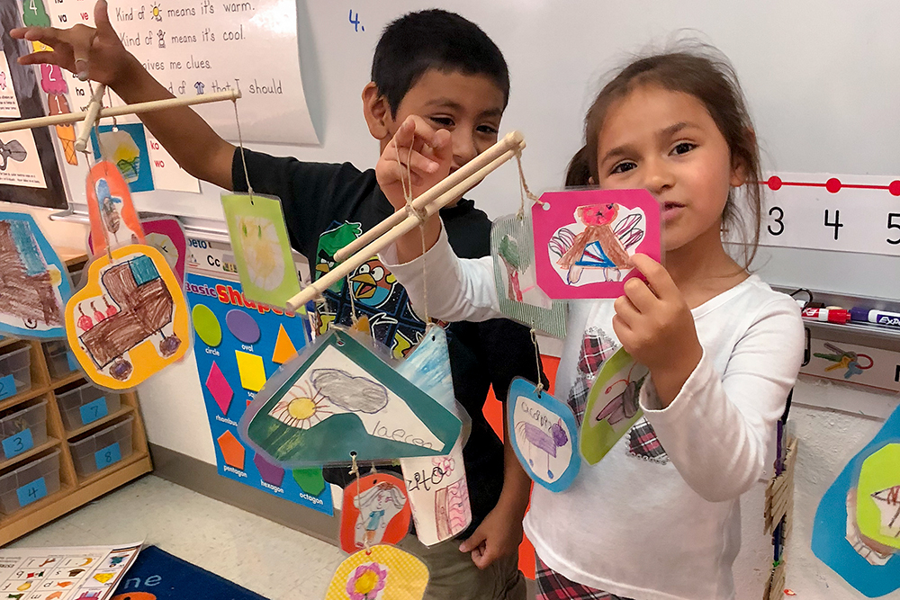 Kindergartners with their crafts