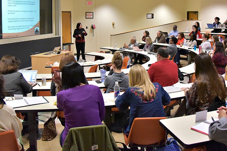 Members of the Department of Curriculum and Instruction faculty listen to a presentation.