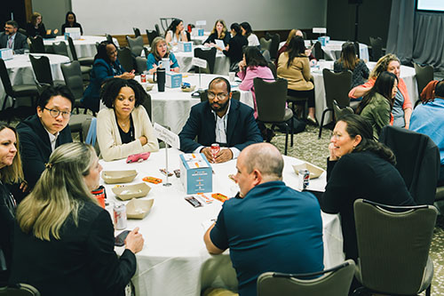 Summit participants engage in roundtable discussions