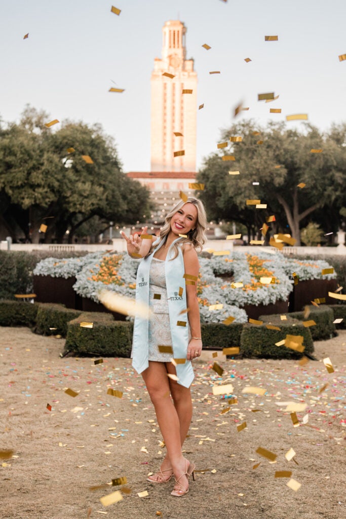 Kelli Mulloy in front of UT Tower.