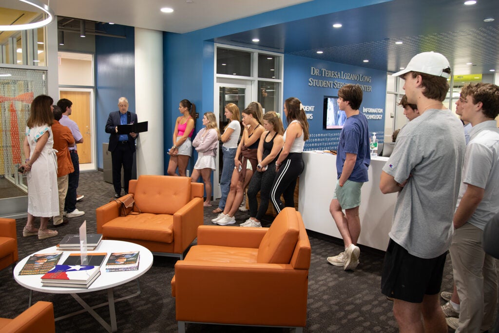 Katherine’s family, friends and classmates at the Huddle Room dedication.