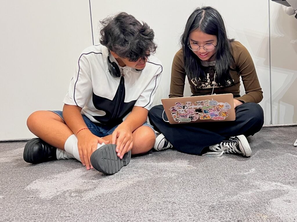 Students working on projects in a classroom in Dubai, United Arab Emirates.