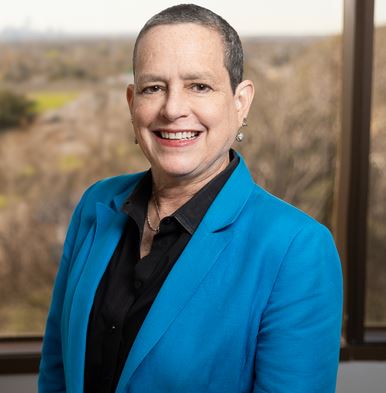 Photo of Susan Dawson in a blue jacket.